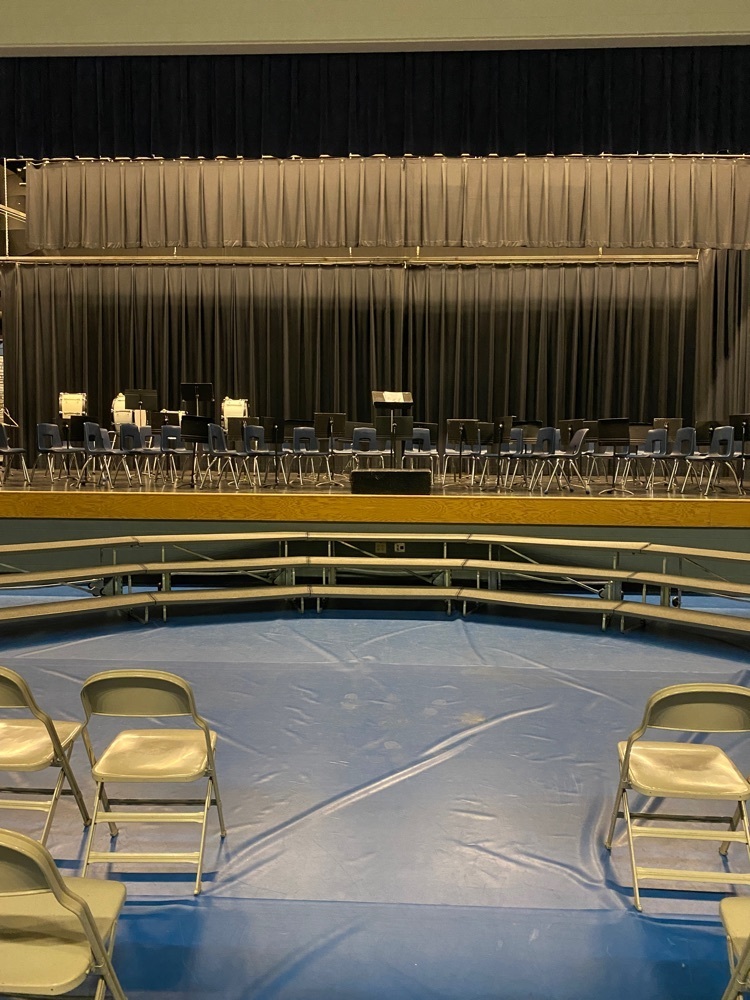 The stage with empty chairs