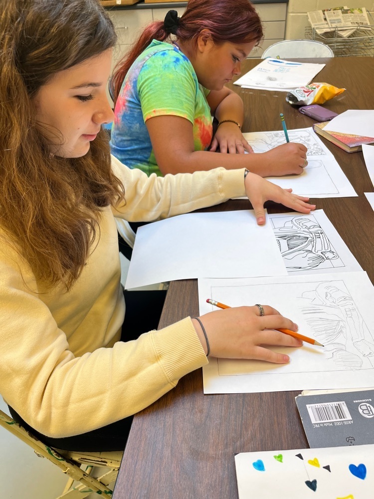 two students drawing