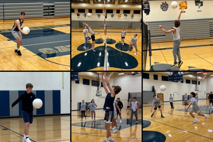various pe students playing volleyball 